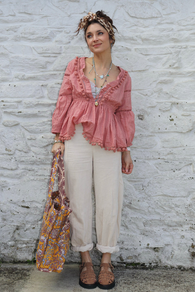 Pom pom detail tiered peach blouse