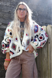 Crochet colourful granny square cardigan