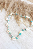Cowrie shell and blue beaded necklace