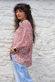 Pink floral peasant blouse