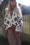 Crochet colourful granny square cardigan