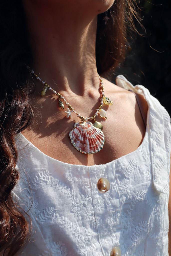 Clam shell and fish necklace