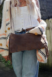 Slouchy leather handbag with fringe detail