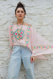 Floral embroidered pink poncho top