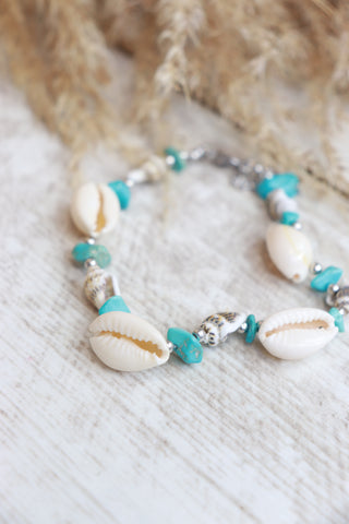Cowrie shell and blue beaded bracelet