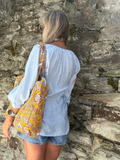 Light blue embroidered peasant blouse