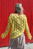 Yellow open-knit crochet top