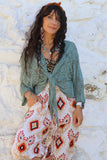 Open knit wrap blouse