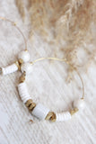 White beaded hoop earrings