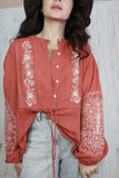Floral embroidered rust blouse